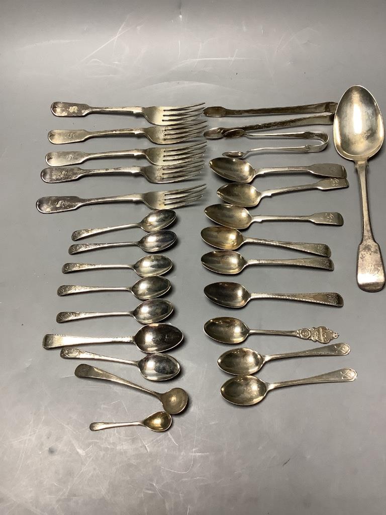 A small collection of silver fiddle pattern flatware, two pairs of sugar tongs and sundry silver coffee and condiment spoons, Georgian and later, approximately 18oz